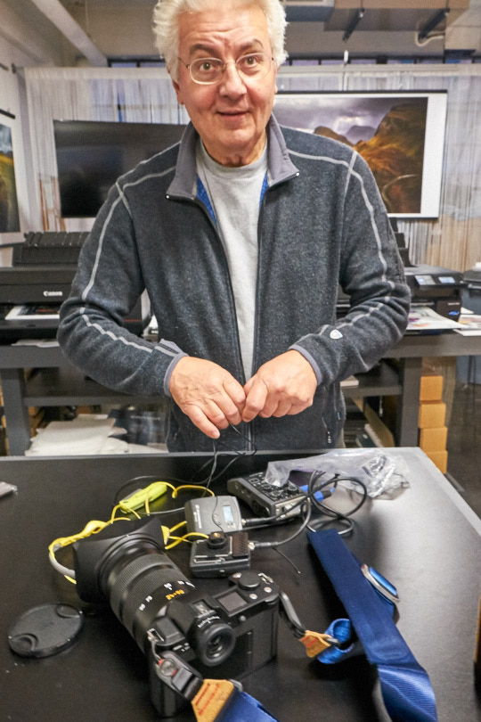 Chris shown trying to stay organized between takes. Notice the Leica SL in the foreground, oh what a nice camera that is.