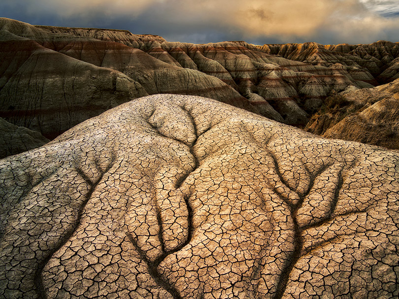 This image was shot in Badlands National Park. I drove 2 full 12 hour days by myself to get there. This was a 10 day solo trip, and was one of the more difficult car trips I have ever made, but I came away with some wonderful imagery. I had plenty of time to photograph off the main roads and trails, but this particular image was taken right next to my car!