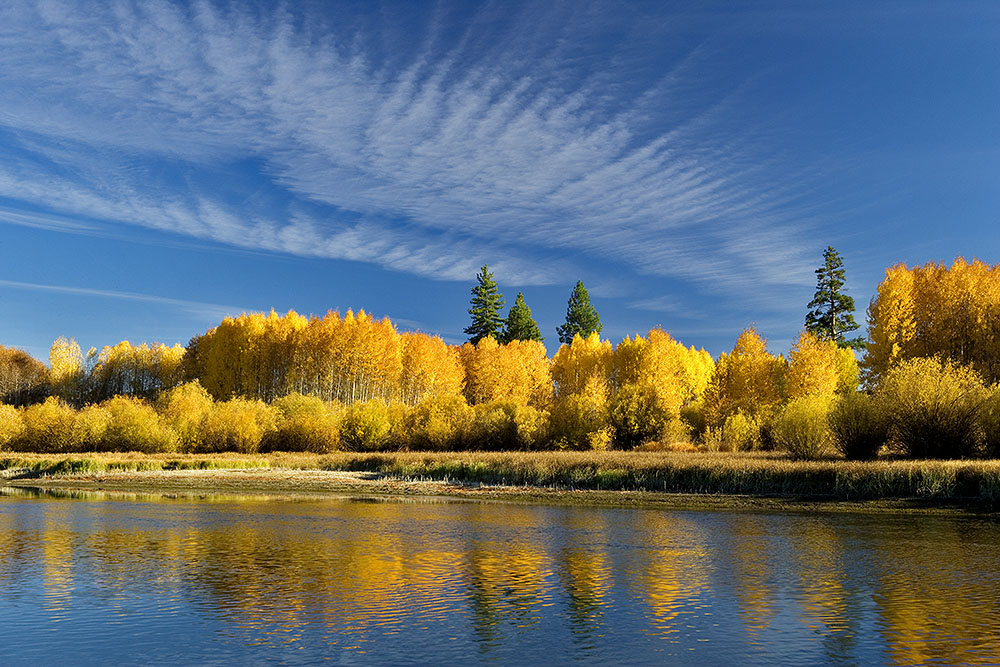 This image was created on a 3 day trip to Central Oregon. When I arrived at this scene wind was fairly strong and the sky a very boring blue. Since I was on an extended trip with nothing else to do except watch TV in my motel room, I just planted myself here on the banks of the Deschutes River and waited for several hours. I was rewarded with this brief cloud cover. The scene lasted just a few minutes returning to the wind and blue sky conditions that I started with. 
