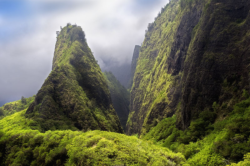 This shot of the Iao Needle in Maui was created when on a family trip. Four of us had hiked up to this vantage point along with what seemed like hundreds of other tourists. I carried my camera gear thinking I probably would get nothing, because it was clouded up and I wasn’t about to ask my family to wait with me for a clearing in the low clouds which could take hours. I got just a second of clearing and was able to click off one shot. Getting a good, well thought out shot with family along is rare for me, but if I had not been brought my camera...