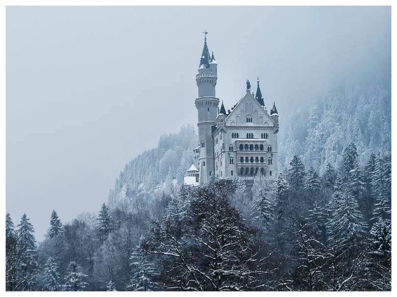 Majestic Neuschwanstein in the bavarian alps covered in a Spring snow