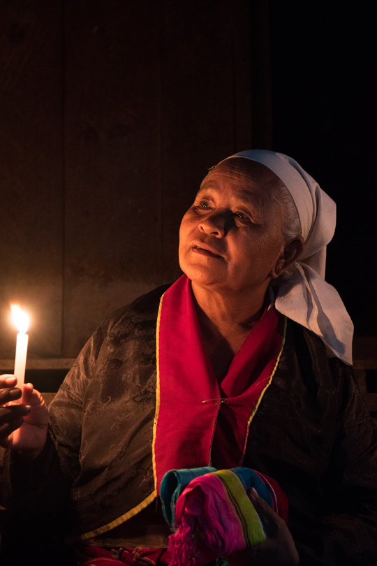 Villager posing with a candle Sony A7RII w/Sony f4 E 16-70mm