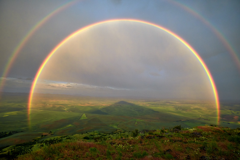 An amazing double rainbow from Steptoe Butte in the Palouse. You can even see the shadow of the mountain. Made with the Fuji X-Pro 2 and the 10-24mm zoom at 10mm. Handheld at 1/105th sec., f6.4 ISO 400