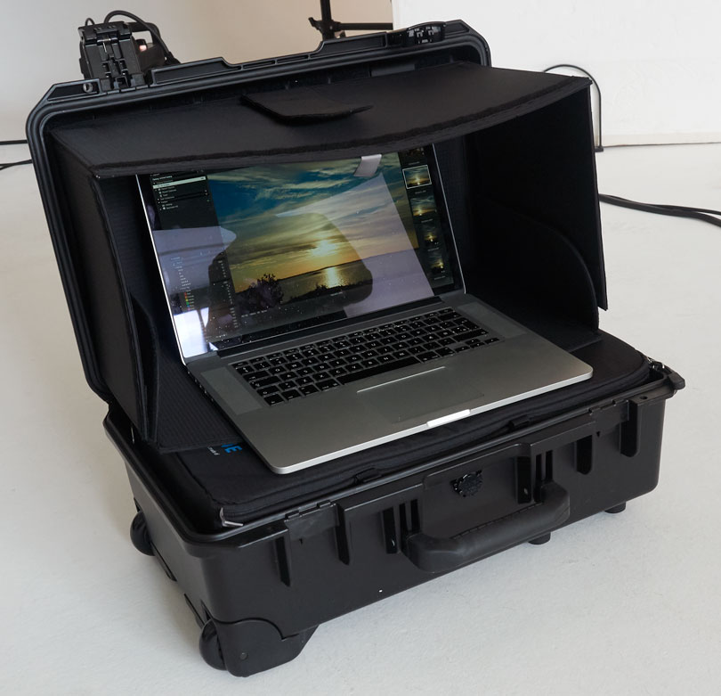 The hard shell case the camera is delivered in can be quickly set up be a workstation with a hood. There is room in the case for a full sized laptop.