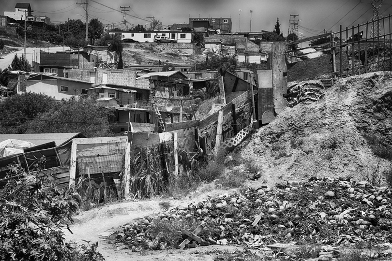 This is the view that Ramon has from his backyard where he makes clay bricks. The coconut shells are used to fire the semi finished bricks in the homemade ovens.