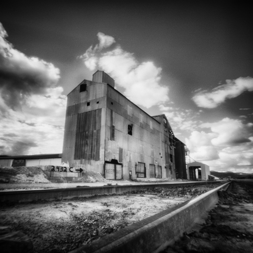 Due to the focus of pinholes being roughly 0-infinity, I also try to find objects with long perspective like this gravel factory in Chewelah, Washington