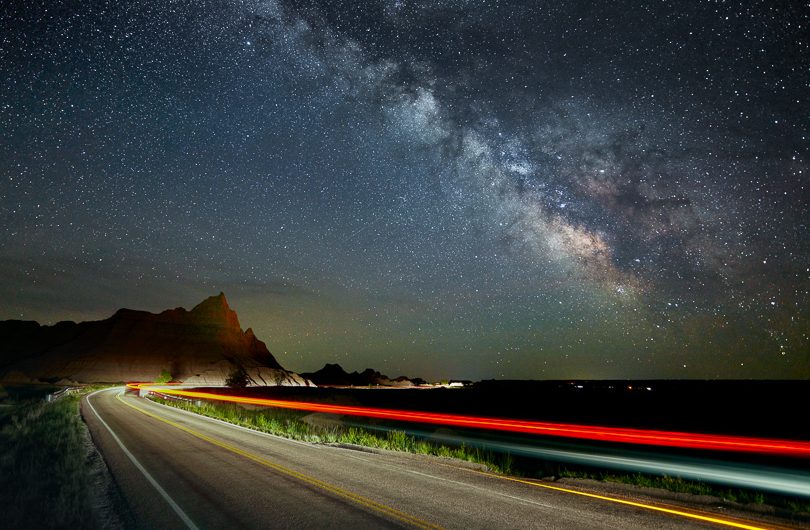 Streaks of light from our car create an interesting foreground that leads to the Milky Way. The sky was exposed separately from the foreground to allow for tracking stars and a different exposure.