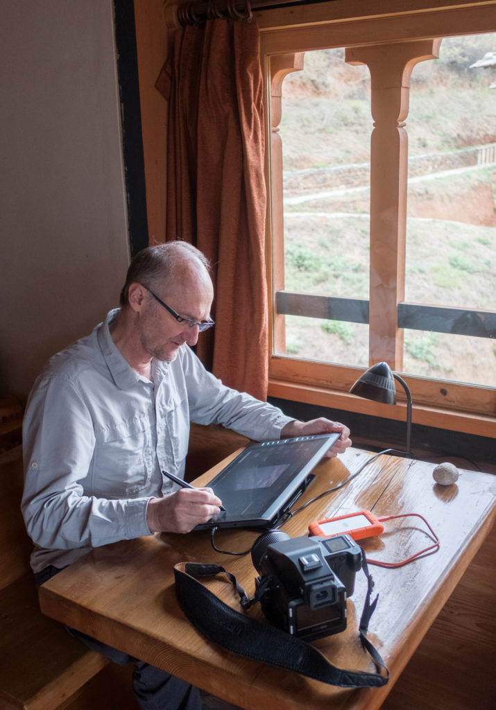 The author in Bhutan, working diligently on location.