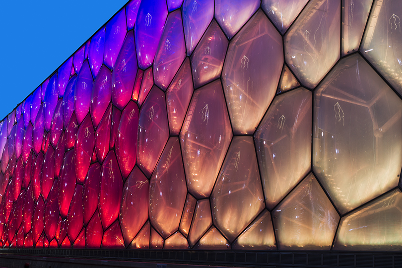 The National Aquatics Center in Beijing, also known as “The Water Cube”, viewed while the soap bubble like façade changes colors.