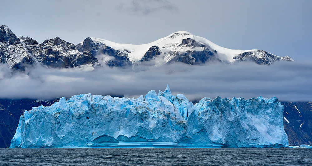Icebergs, Mountains, Water, and the big sky. All part of Greenland