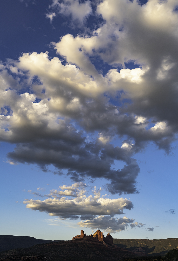 Ragged vertical cloud stack over Carrousel Rock
