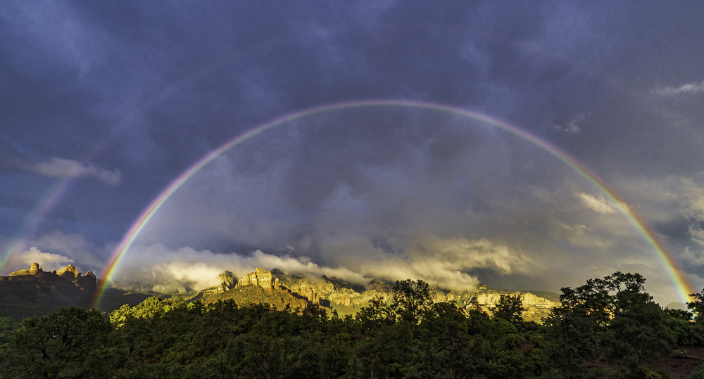 Violent storm gives way to a wide double rainbow