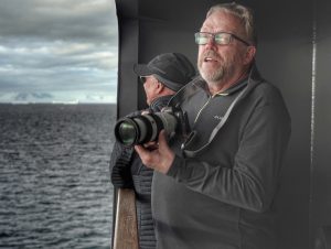 Art Wolfe and Kevin Raber photographing the iceberg