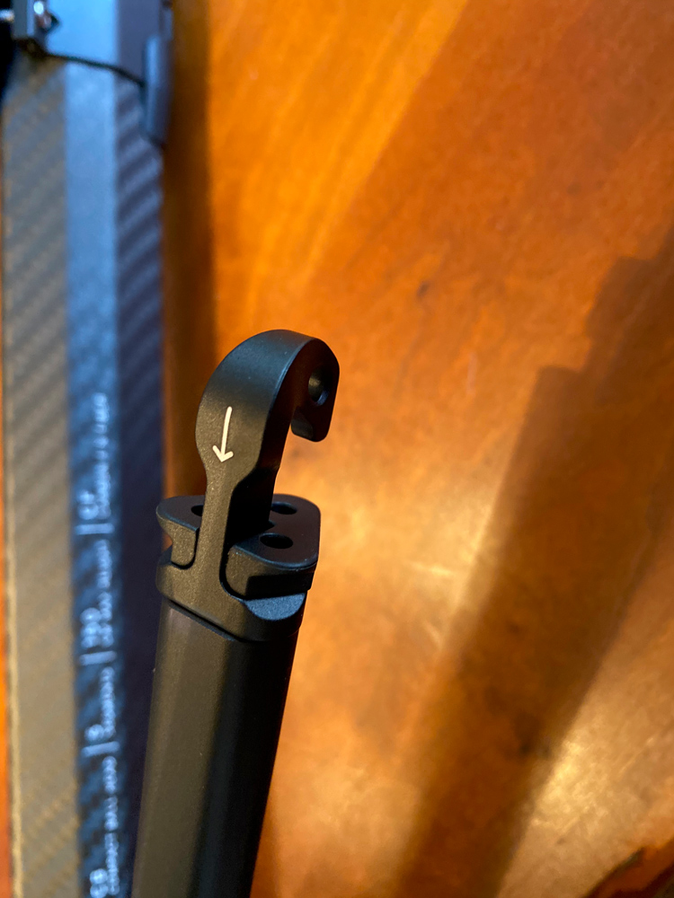 The center column hook for adding weight for stability. It also doubles as an iPhone mount.