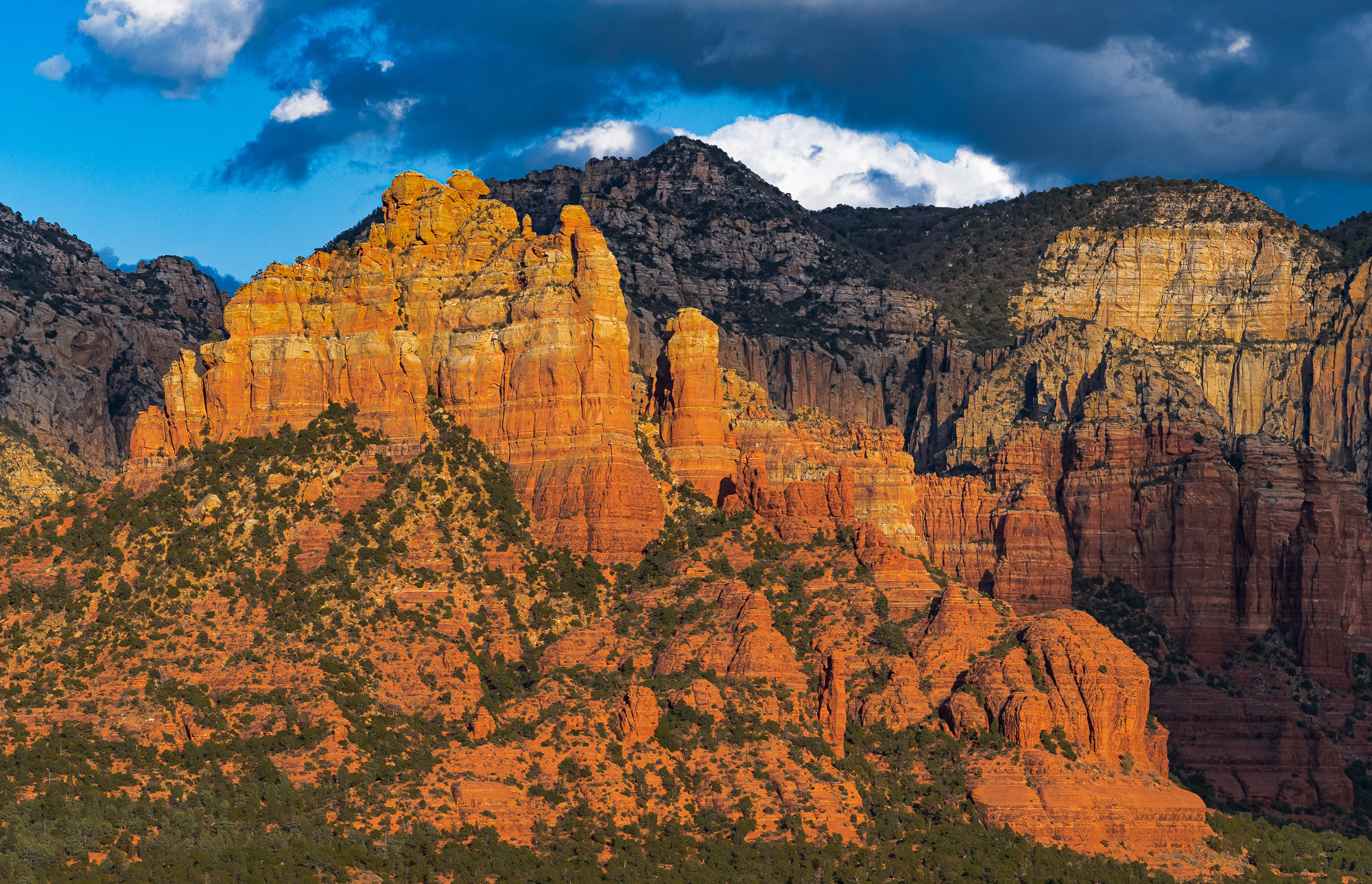 Crimson Cliffs, Bright Clouds & Deep Shadows