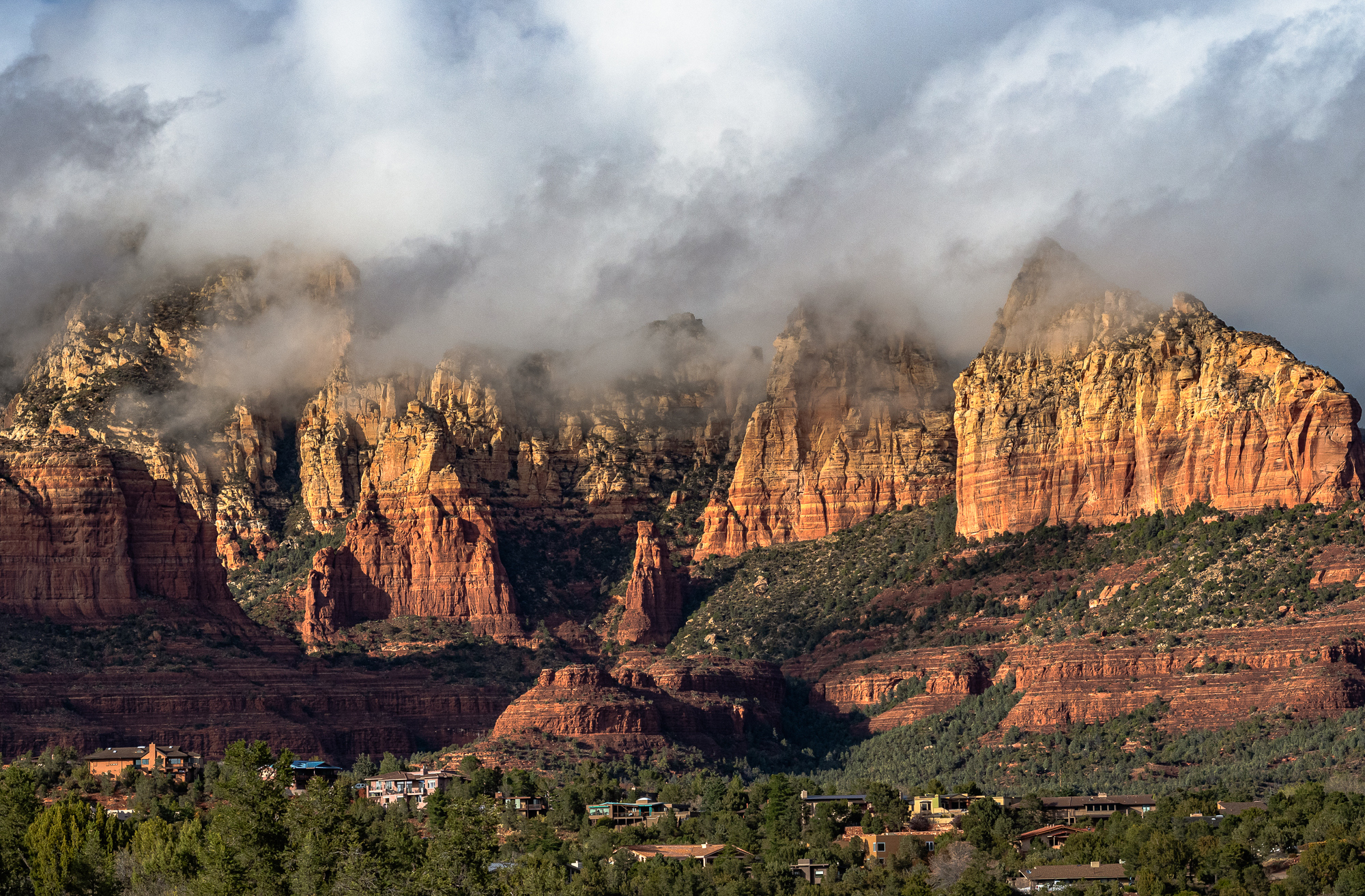 Moody Red Rock Scene Strongly lit by Setting Sun