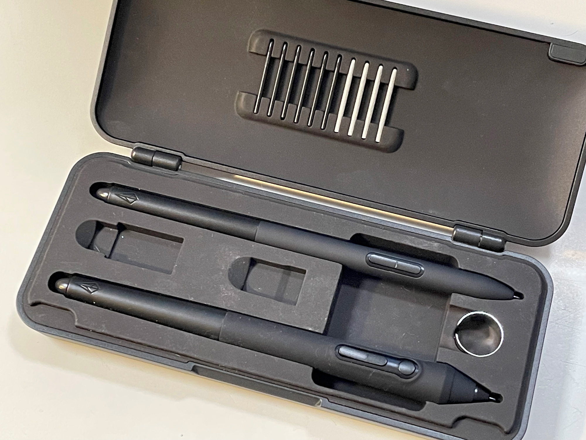 The thin and thick pen come in a great sturdy case with the USB dongle and adapter as well as extra nibs for the pens