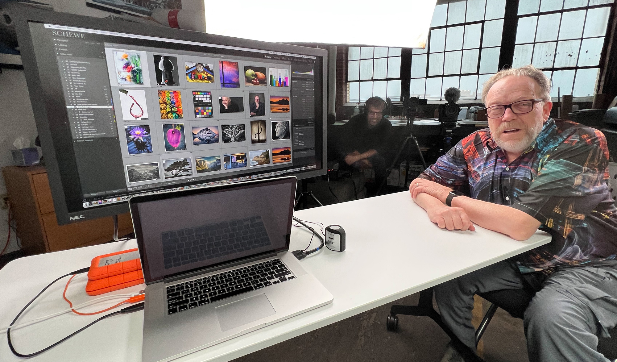 On the table is my MacBook Pro and the NEC display with Kevin and, in the background, videographer Michael Durr. Michael likes to stay in the background.