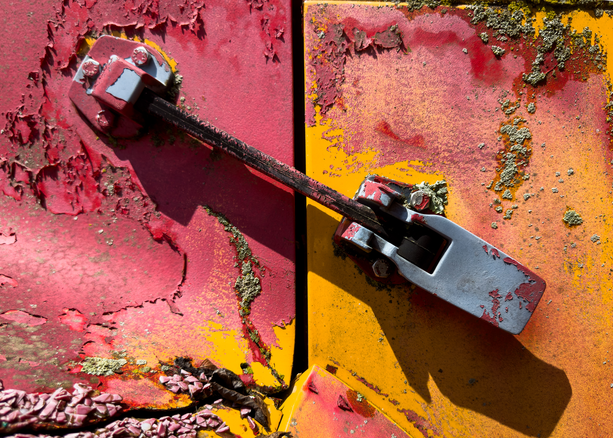 Texture and color. This is the latch for a bus engine hood