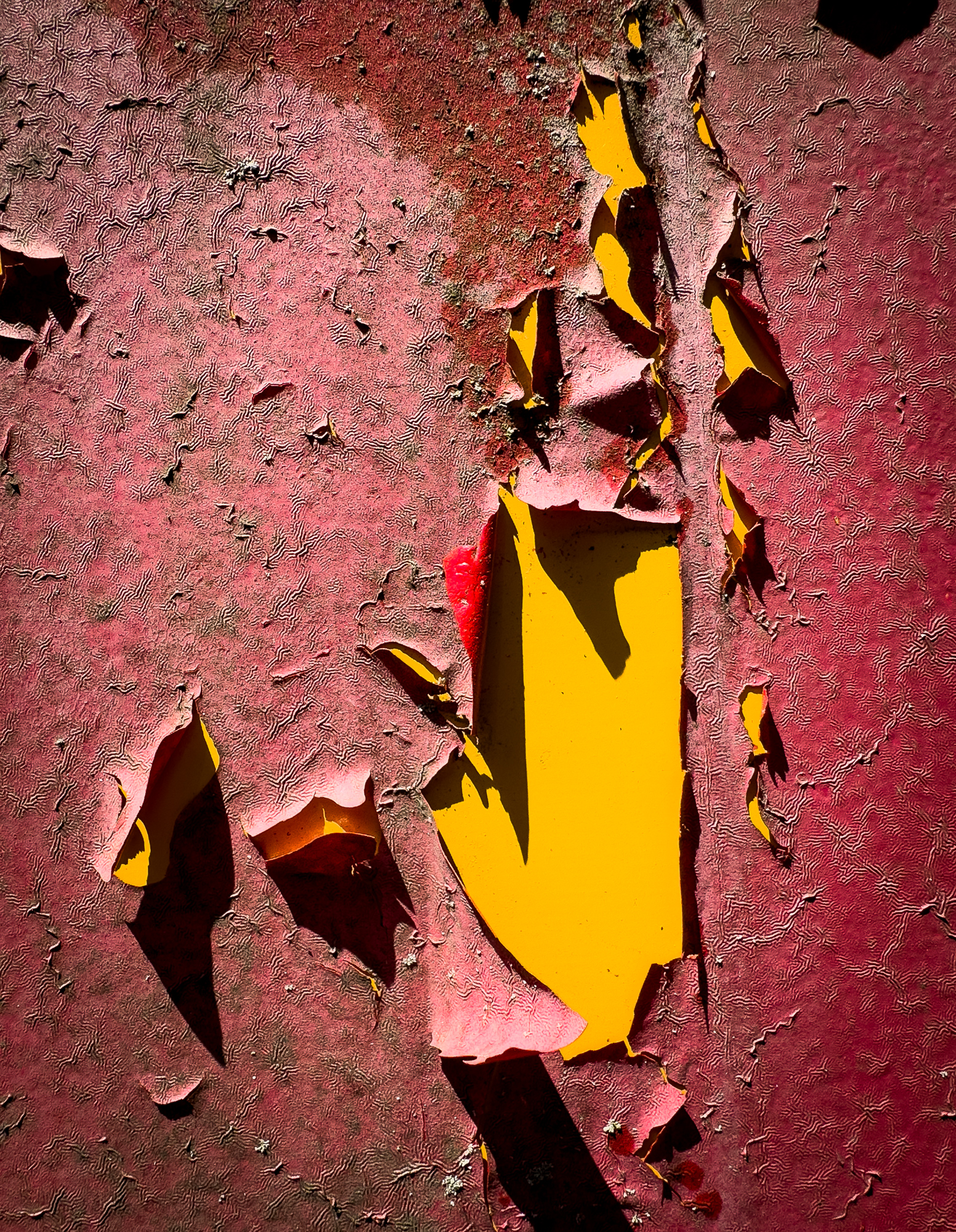 Peeling paint is beginning to show the bus's true color