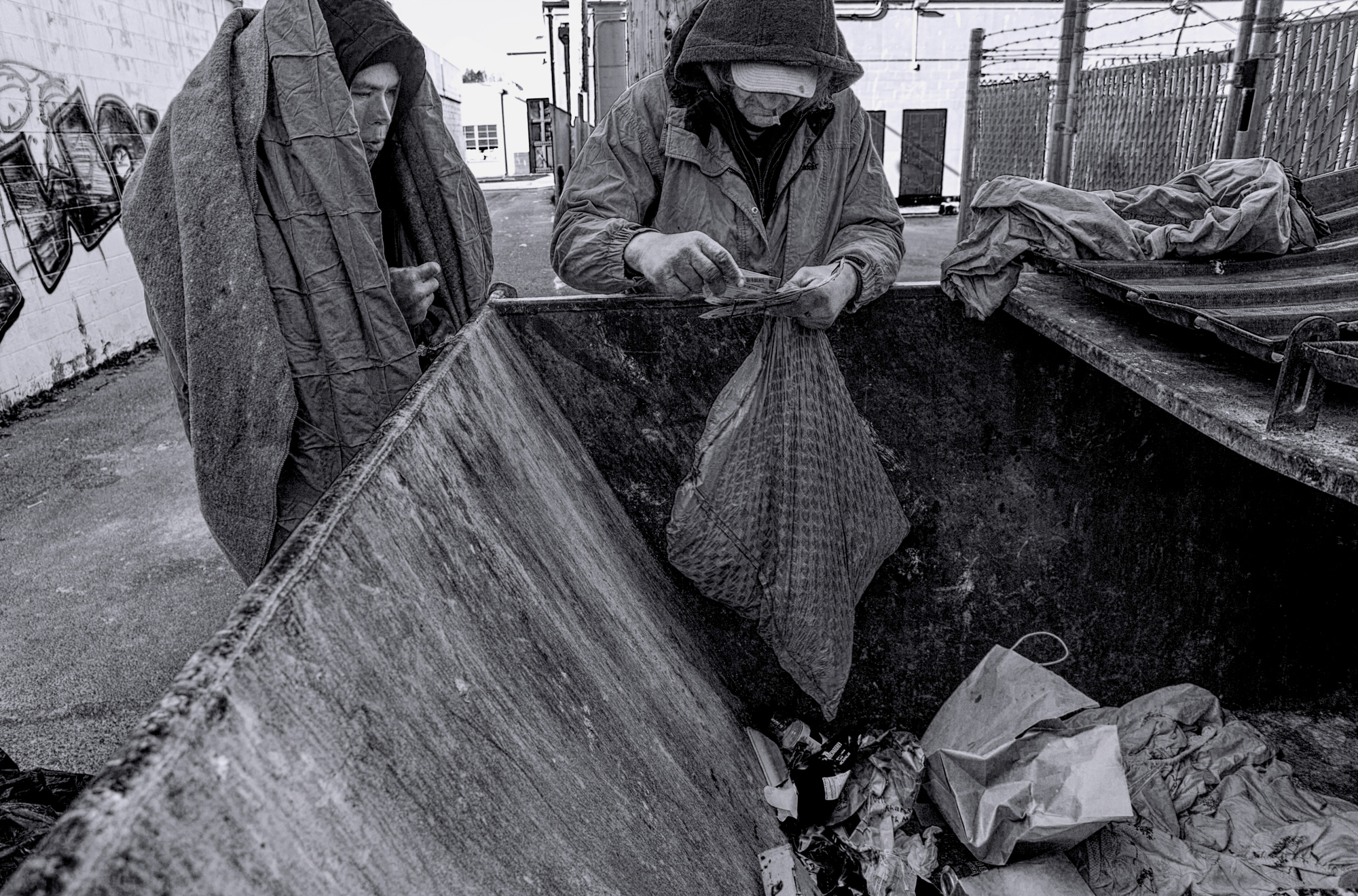 DIGGING THROUGH A DUMPSTER 