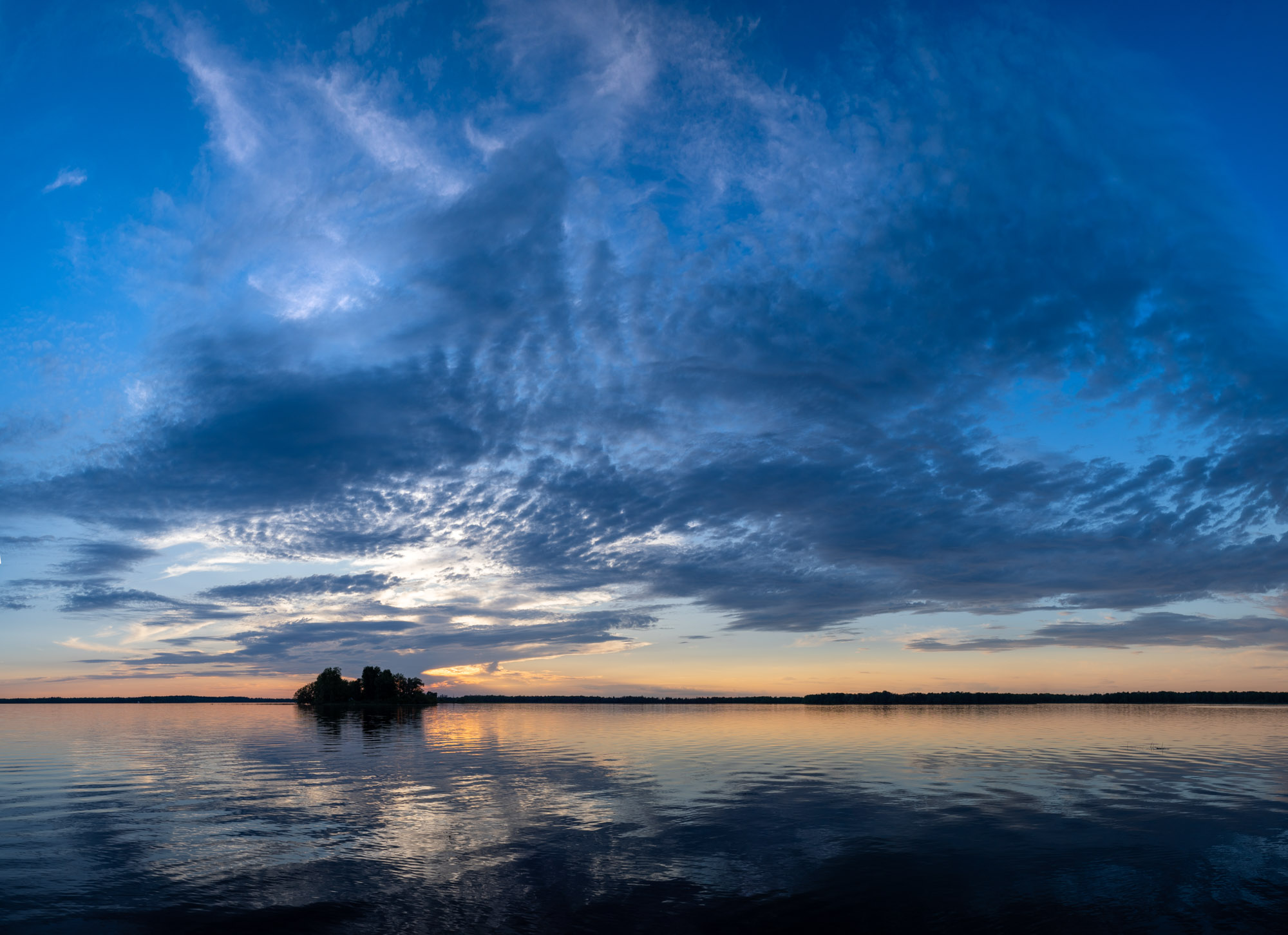 Dancing Clouds, Rideau Lake, Ontario. 21-photo merge; 25mm (50mm efov), ƒ5.6 @ 1/125, ISO 200; raw files processed in Lightroom.