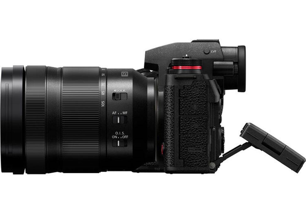 Side view of the Panasonic Lumix S1R II mirrorless camera with a 24-105mm lens attached, showcasing its ergonomic grip, autofocus controls, image stabilization switch, and full-size HDMI port for professional video output.