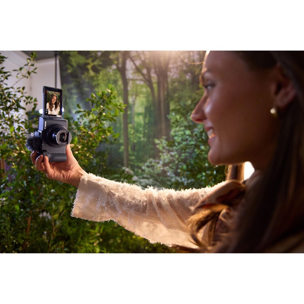 Woman vlogging with Canon PowerShot V1 camera in nature setting