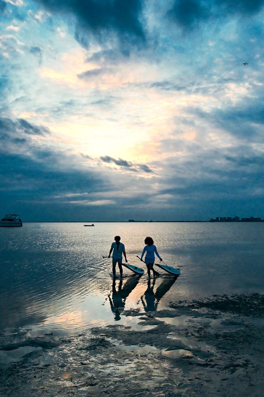 Two people paddleboarding at sunset, captured in stunning detail with the Nikon Z5 II’s low-light and dynamic range capabilities