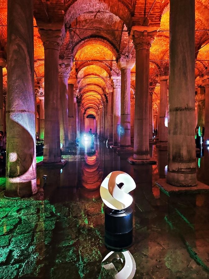 White spiral sculpture in Basilica Cistern with columns and reflections