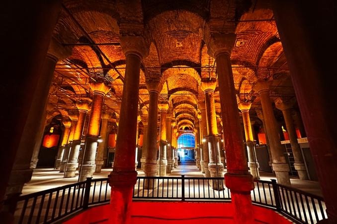 Basilica Cistern columns leading to bright exit with warm glowing arches