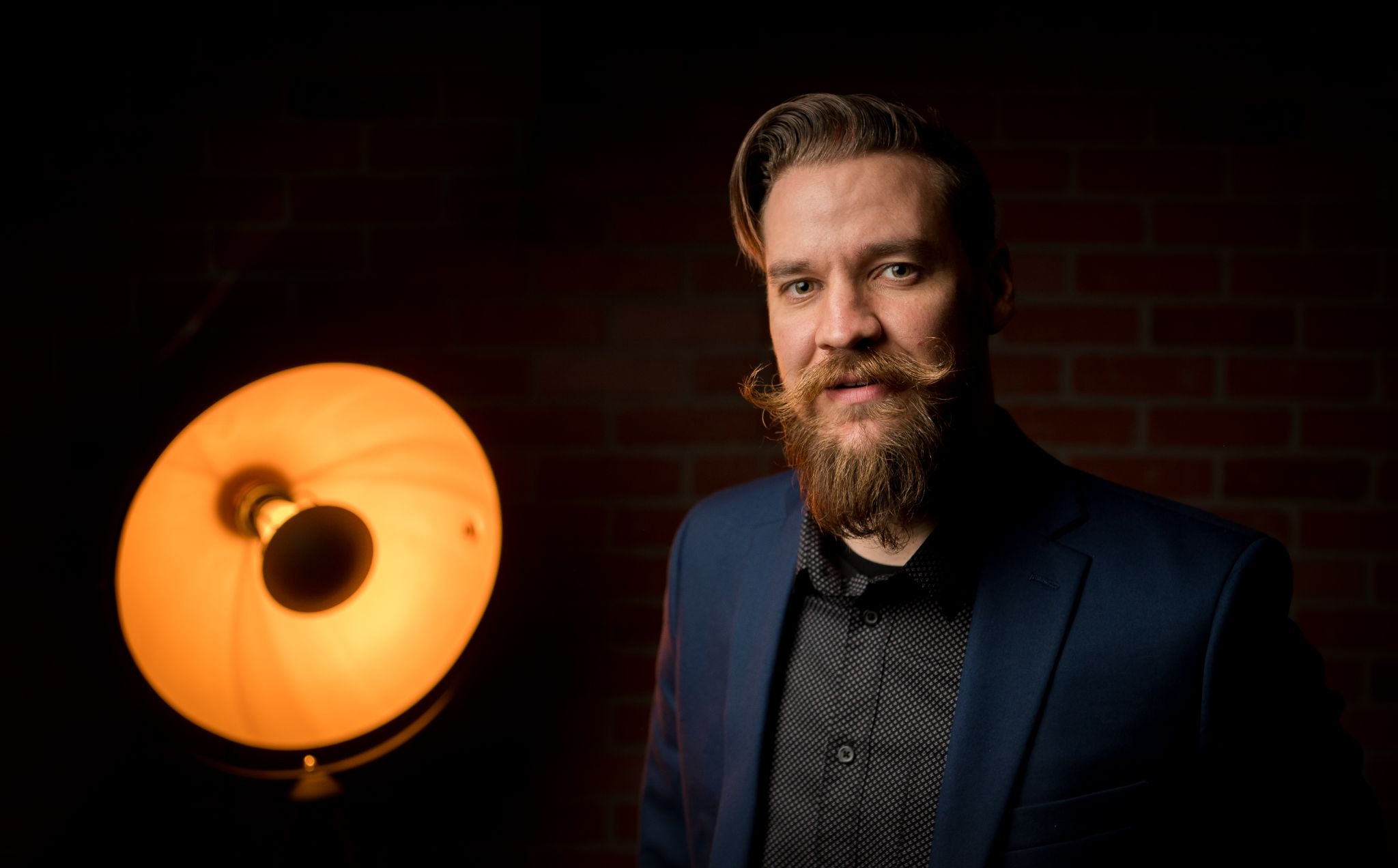 Justin Benson, CEO of Aftershoot, portrait with studio lighting discussing AI tools for photographers