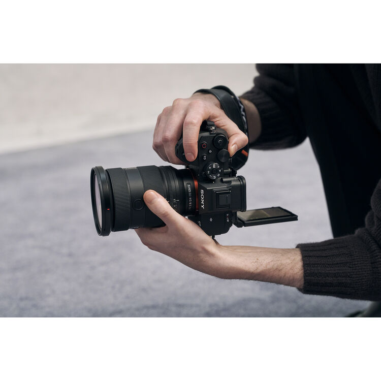 Person holding Sony a7R VI with flip-out screen