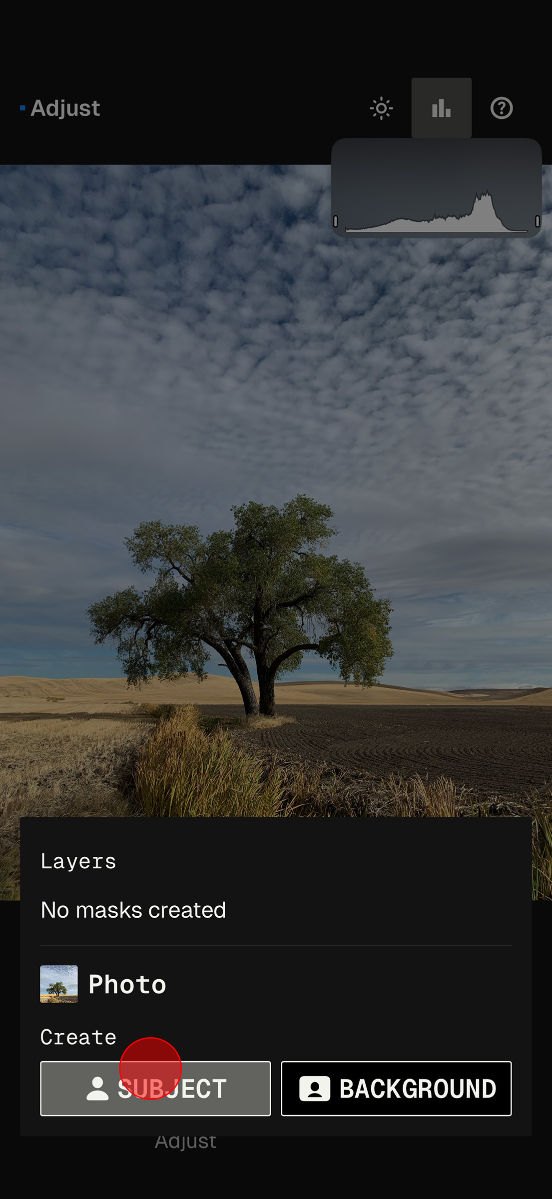 SnapSeed masking tool preparing automatic subject selection on a landscape image.