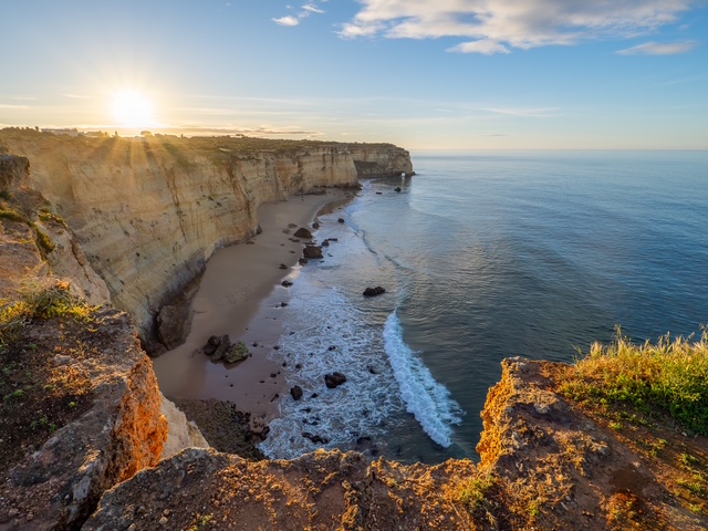 Sunrise over the rugged cliffs of the Algarve Coast in Portugal