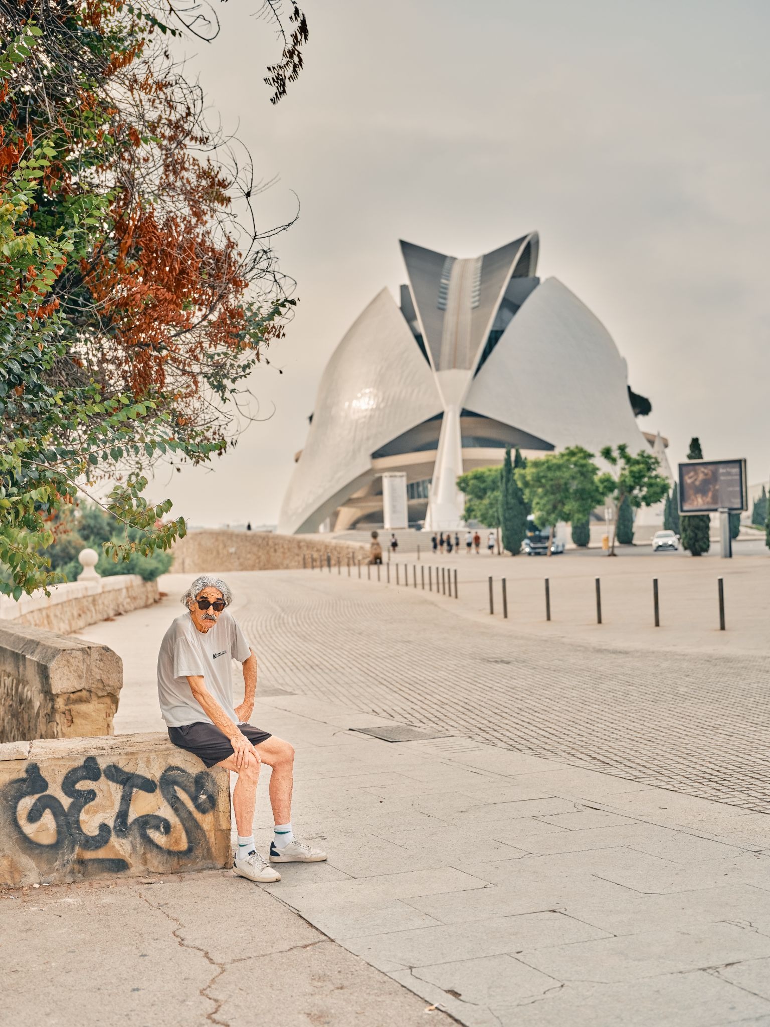 Man sitting near Valencia's City of Arts and Sciences.