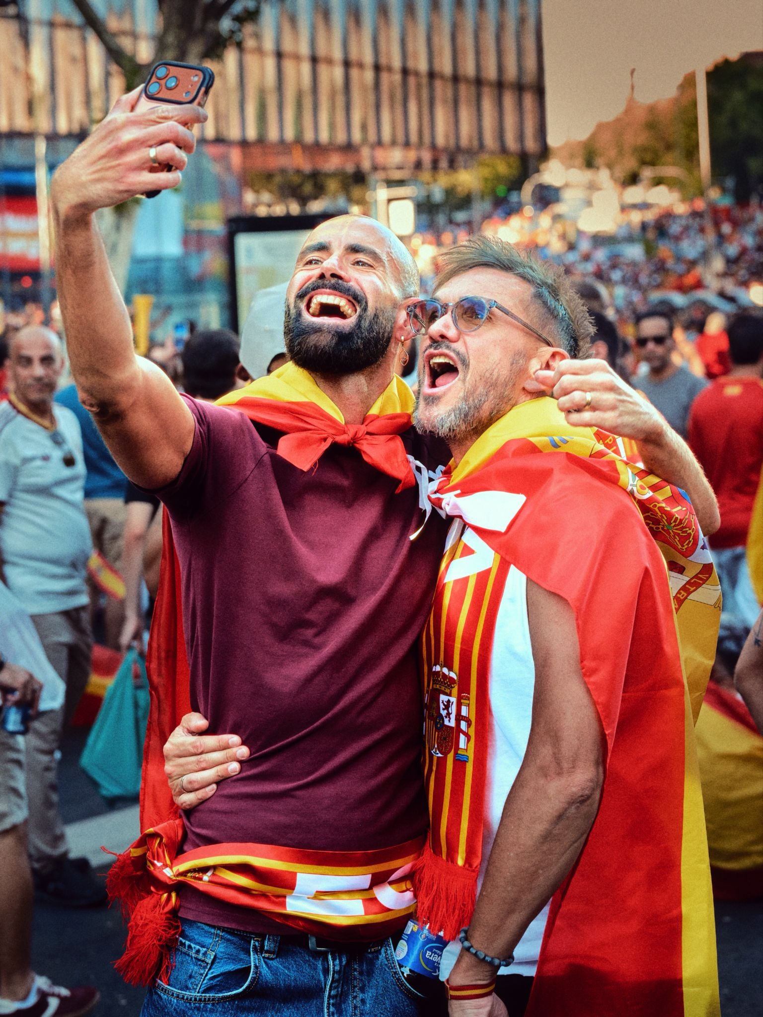 Two Spain fans taking a celebratory selfie after the match.