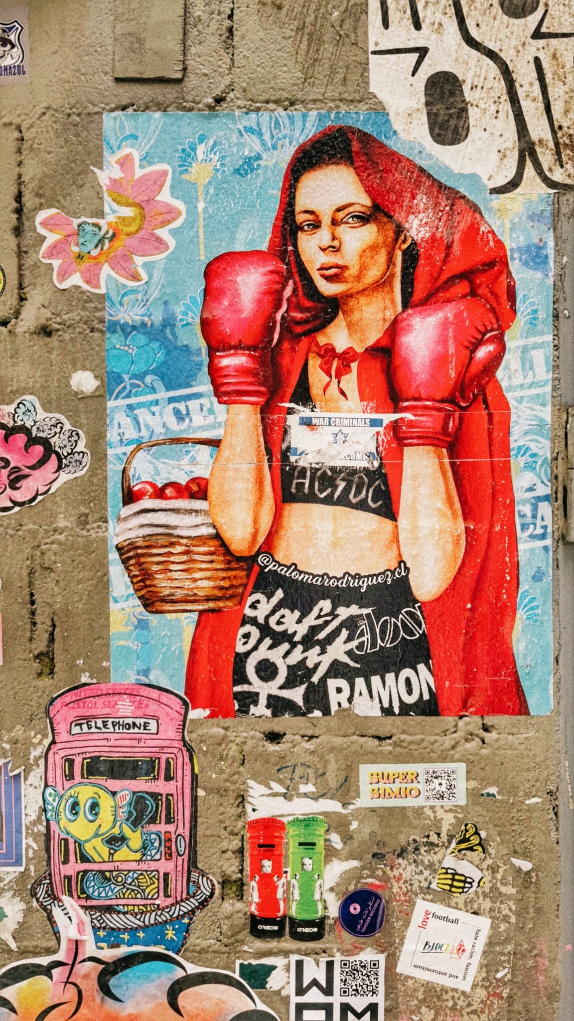 Street art of Little Red Riding Hood wearing boxing gloves.