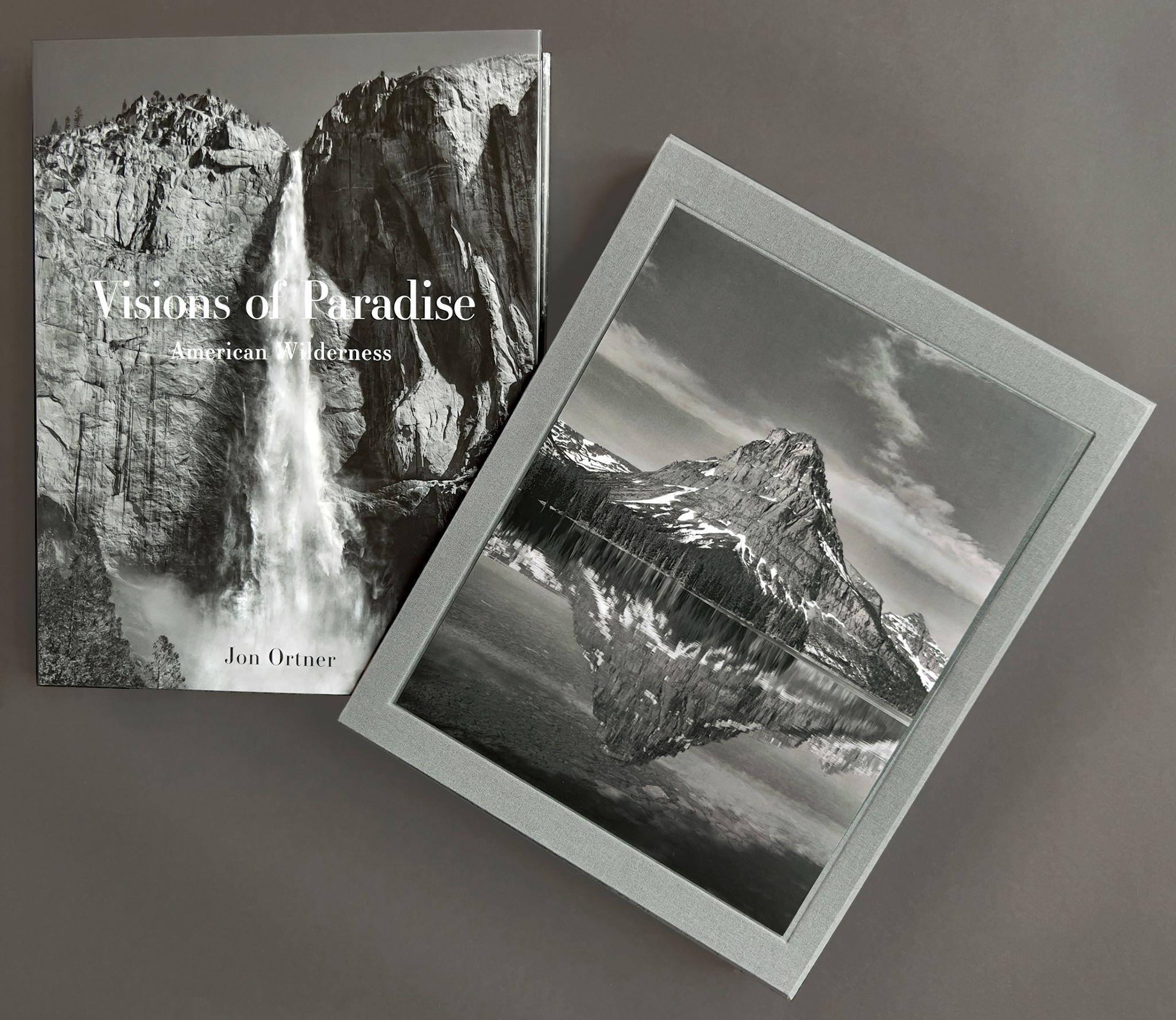 Visions of Paradise book beside a black-and-white fine art landscape print