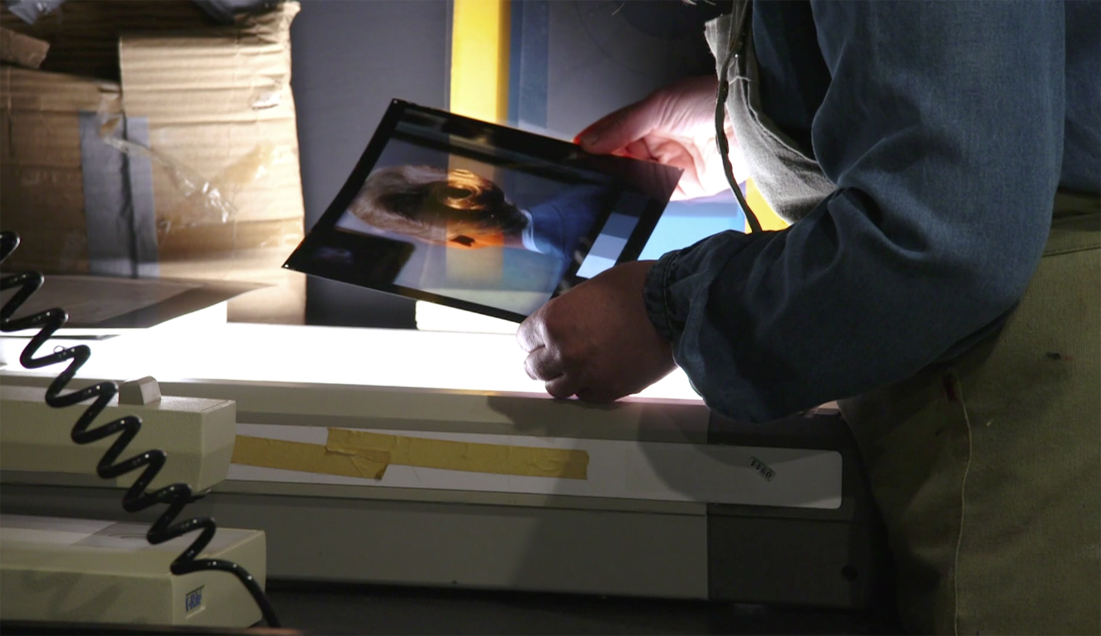 Jean Curran examining a photographic print during the dye transfer process