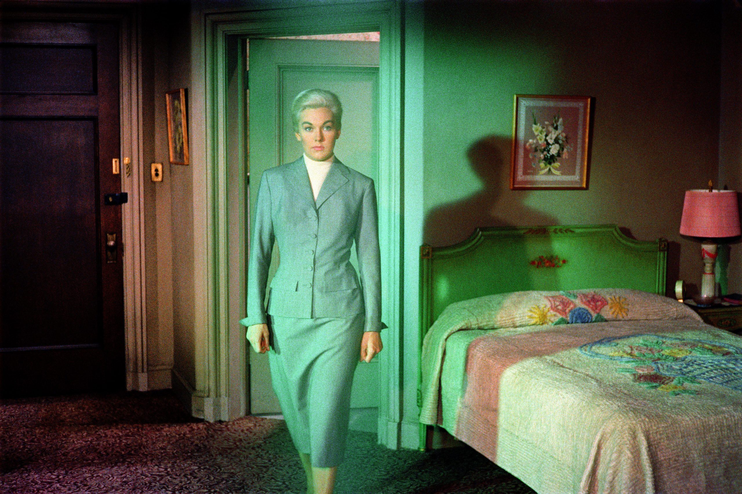 Jean Curran Vertigo Project print showing a woman in a green-lit room