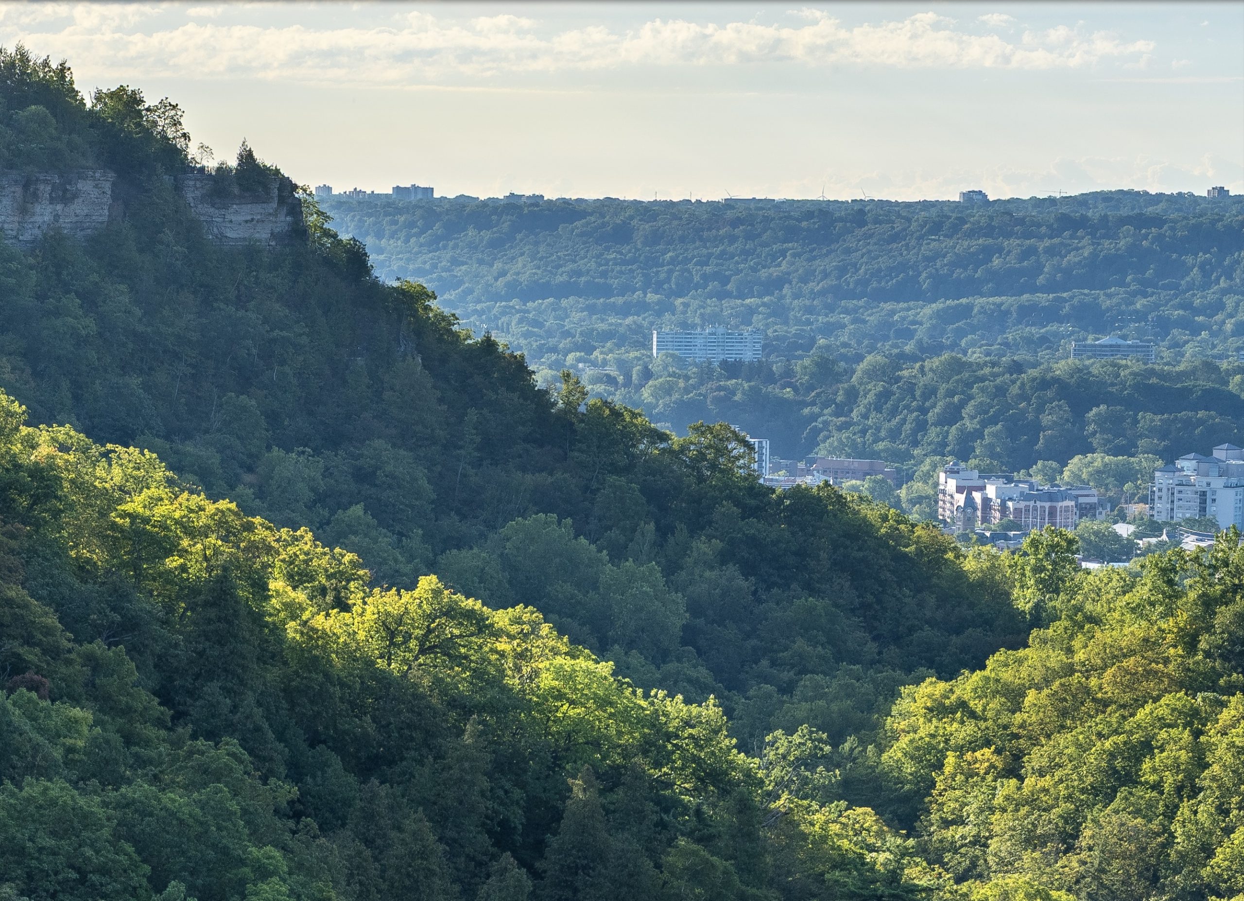 100 percent crop showing distant buildings in a Fujifilm GFX 100S II landscape photograph.