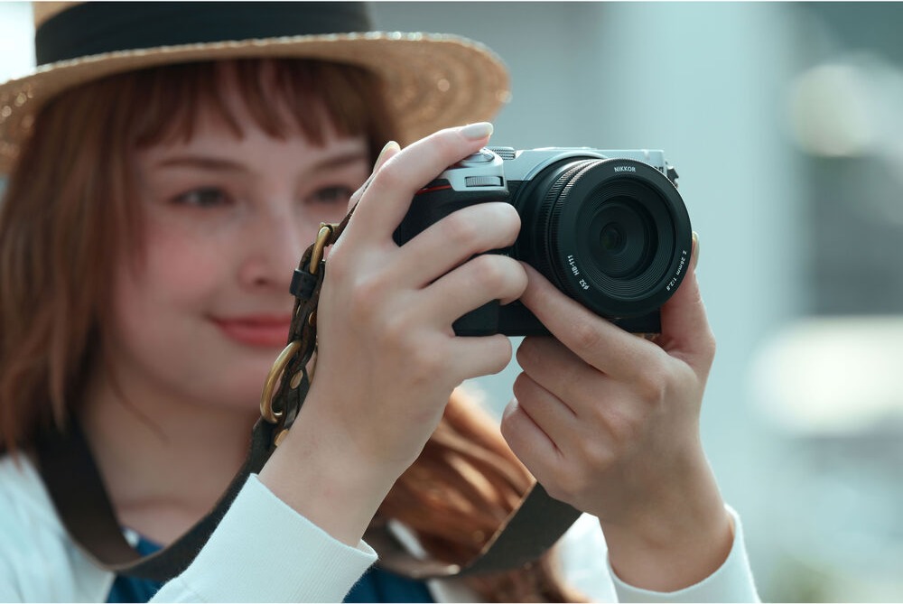 Photographer using a Nikon Z5IIC mirrorless camera