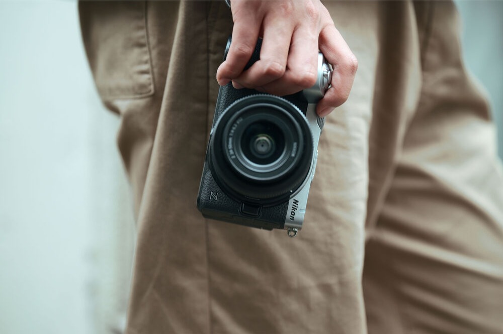 Nikon Z5IIC full-frame mirrorless camera being held by a photographer