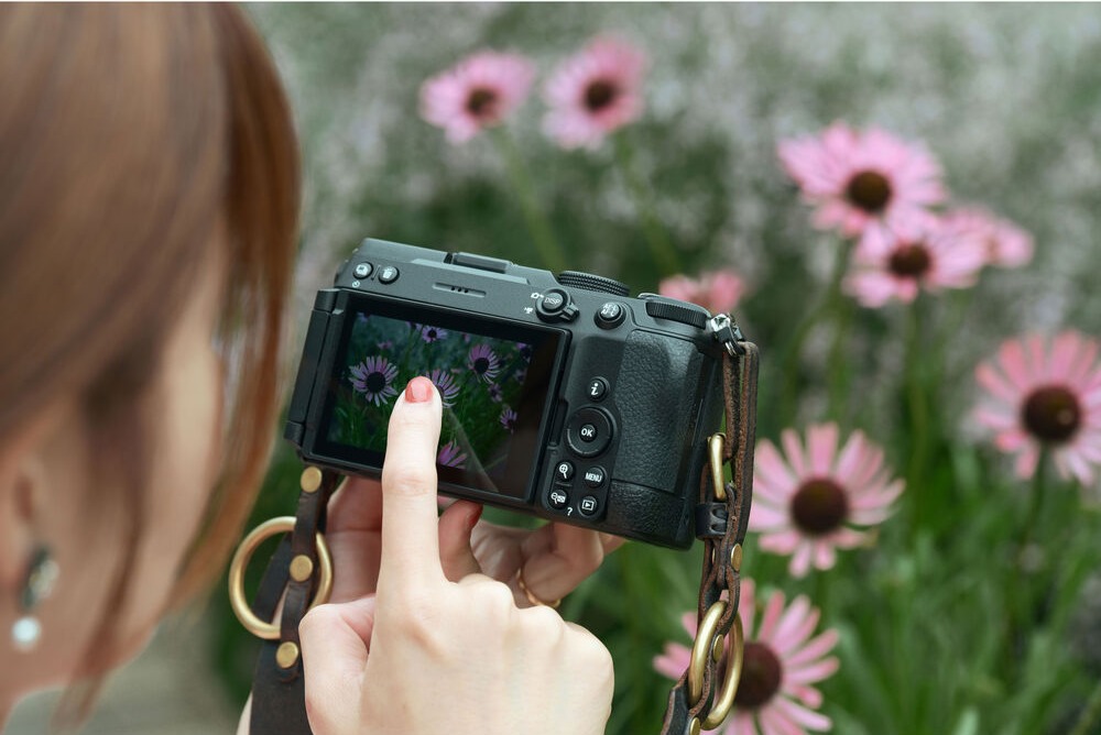 Nikon Z5IIC camera with rear screen showing a flower composition