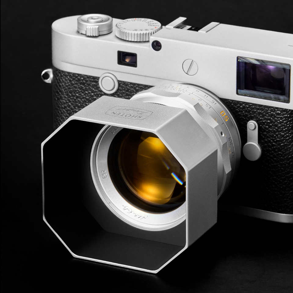 Silver Shoten Tribute 01 lens with hood on a Leica camera
