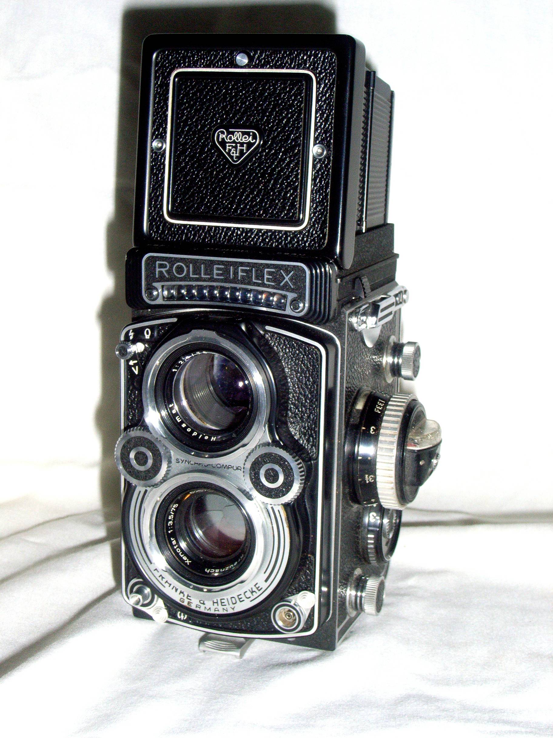Rolleiflex 3.5F Planar twin-lens reflex film camera photographed against a white background.